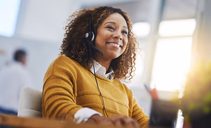 A smiling customer support representative